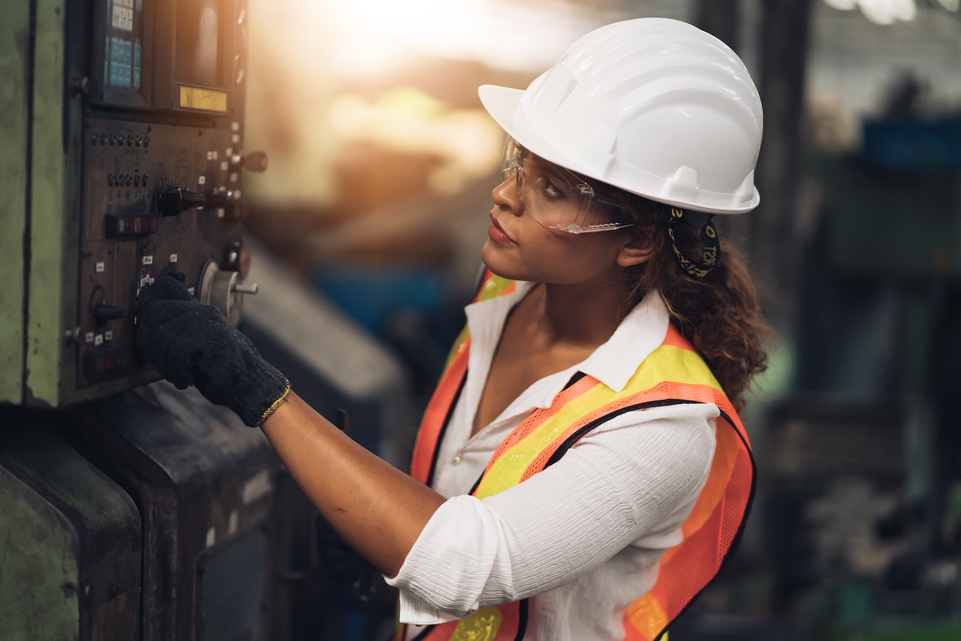 Female engineer working quality control of a warehouse machine